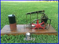Large scale walking beam steam engine with water pump hit and miss